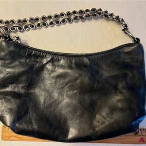 Black leather handbag.  Silver trim.  Very good and so cute